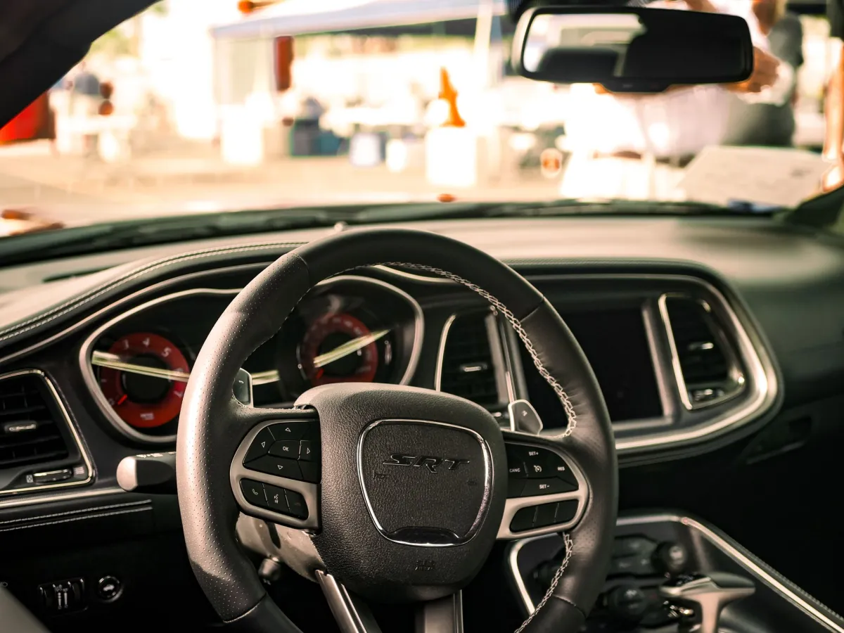 The steering wheel and dashboard of a modern car